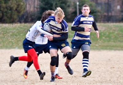 Kevin Bunce Jr. of East Hampton, with the ball above, and Eddie Arens of East Islip were, with their Section XI Warrior teammates, thrown into the fire at the New York 7s tournament on Randalls Island last weekend.