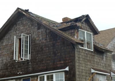 The smell of a burning roof was still evident a few hours after a fire started at a house at 62 Cross Highway in Amagansett on Saturday morning.