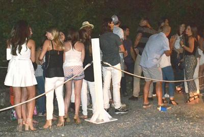 The scene outside a Montauk nightclub in July. East Hampton Town officials plan to take a harder line in the hamlet in 2016.