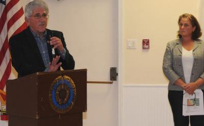 Following her presentation Monday on the East Hampton Housing Authority's proposed affordable housing complex in Amagansett, Katy Casey, the group's executive director looked on as Town Supervisor Larry Cantwell addressed the large crowd gathered in the American Legion Hall.