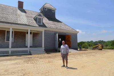 David Lys, the chairman of the committee and president of the Amagansett Life-Saving and Coast Guard Station Society, outside the nearly-finished building.