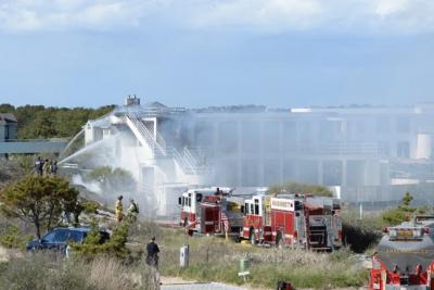 Firefighters doused flames, quickly putting a stop to a fire that spread from a Dumpster to the house.