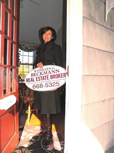 After more than a decade, Kathleen Beckmann has taken down the business sign in front of her house and joined forces with Town and Country Real Estate.