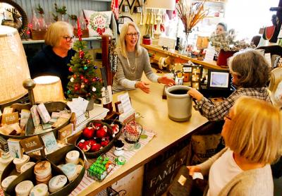 Vicki Nolan, center, helped customers at the Country Lane gift shop in Sag Harbor. With the sale of the building imminent, she is closing the shop after 20 years.