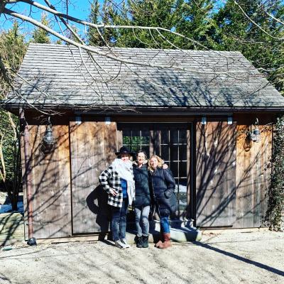 The Shed co-founders, Amanda Fairbanks, Sarah Cohen, and Liza Tremblay, stood outside the new, permanent home for their women’s-only co-working space in Sag Harbor the day they signed their lease. A second cottage on the premises will be available to members for hourly rentals as a conference room. 
