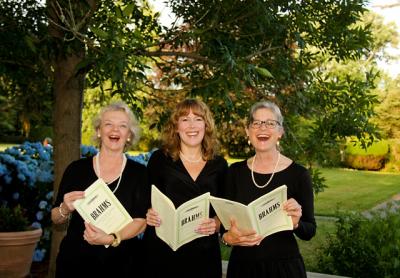 The Choral Society of the Hamptons, three of whose members can be seen here rehearsing for last summer’s concert, will perform Carl Orff’s “Carmina Burana” on Saturday.