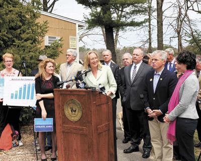 County Legislator Bridget Fleming, center, was among the officials who support County Executive Steve Bellone’s proposal for a referendum to tax water bills to create a water pollution abatement fund.