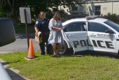 Julia Moffett was led into East Hampton Town Justice Court for her arraignment on Thursday. Her lawyers said "there is no evidence that my client has done anything wrong."