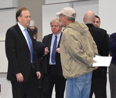 Representative Lee Zeldin and other officials mingled with constituents and colleagues before the hearing began. Assemblyman Fred W. Thiele Jr. can be seen to the right of Mr. Zeldin.