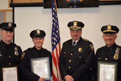 Chief Gerard Larsen, second from right, congratulated his officers who were involved in saving the life of a man who collapsed at the Maidstone Club in September. From left, Officer Matt Kochanasz, Officer Steven Niggles and Sgt. Richard Mamay.