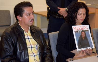 Maria Duchi holds a poster with her aunt, Lilia (Esperanza) Aucapina's photograph on it. Ms. Duchi spoke at a press conference about Ms. Aucapina's disappearance, along with Ms. Aucapina's brother, Victor Parra, left.