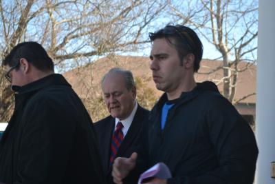 Robert Andrade, on the right, left East Hampton Town Justice Court on Thursday after he was arraigned on four misdemeanor charges.