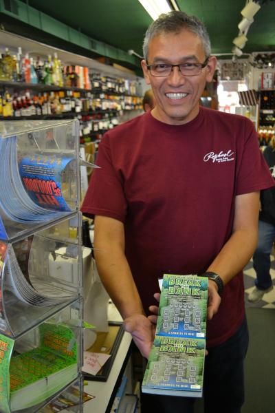 Guillermo Vernaza, who works the register at Montauk Liquors, said a lucky Montauk couple won $1 million from a scratch-off game called Break the Bank.