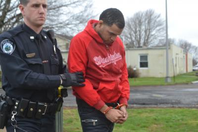 Devon Trent was led into East Hampton Town Justice Court on Thursday morning to be arraigned on a felony robbery charge.