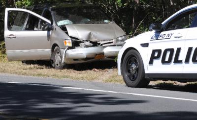 The driver was injured after her minivan hit a tree on Route 114 in East Hampton Monday morning.