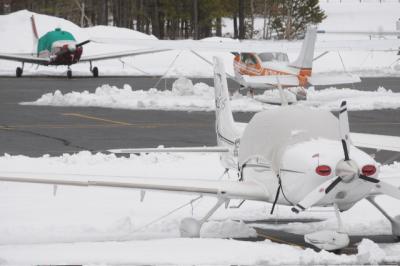 Snow not only kept these planes on the tarmac, it has postponed a hearing on the proposed restrictions at East Hampton Airport.