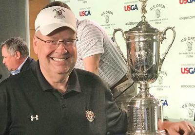 Jon Diat took advantage of a golden opportunity Monday to pose with the U.S. Open’s silver cup.