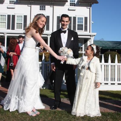 Tara and Kevin O’Brien, newlyweds, posed for photos after their wedding ceremony at the Hedges Inn in April, overcoming a bitter permitting dispute between East Hampton Village and the inn.