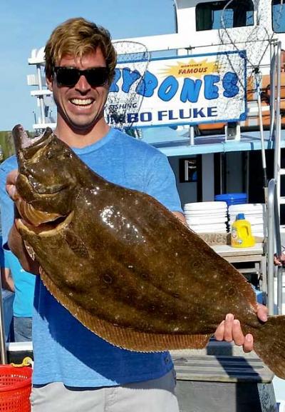 Orson Frisbee held an 11-pound, 8-ounce fluke caught on the Lazybones out of Montauk.