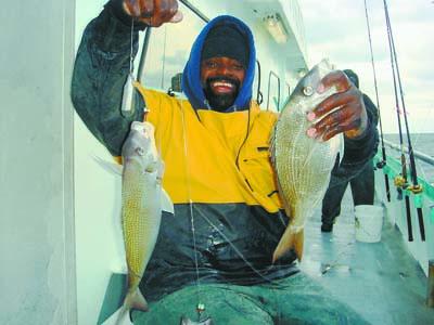 Gil Parker hefted two fat porgies