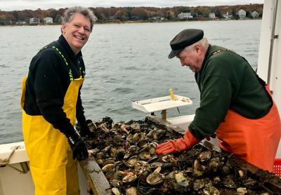 The opening day of scallop season in state waters was surprisingly promising, as Robert Cugini, left, and Ray Sperling discovered on Monday.