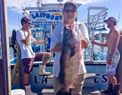 Nina Neumayer landed this 32-pound striped bass on the Montauk party boat Lazybones.