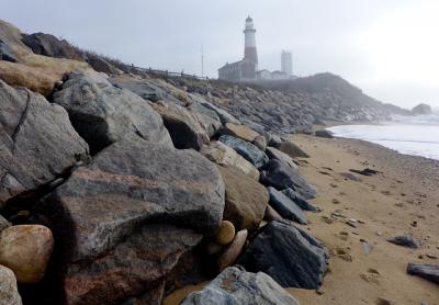 The rock revetment protecting the Montauk Lighthouse is to be reconstructed and enlarged to better protect the historic landmark from the ocean and extreme weather.