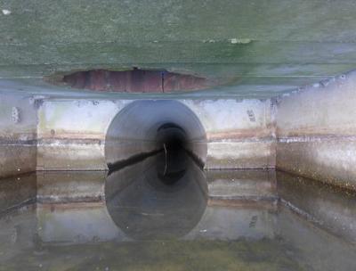 The Cove Hollow end of a roughly mile-and-a-half concrete drain pipe that reaches to the fields off Route 114 in East Hampton