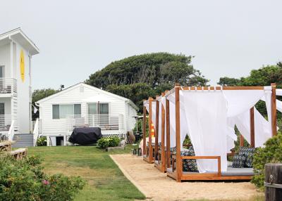 The owners of the new Hero Beach Club motel in Montauk recently added daybeds and other features to an outdoor lounge on the property. A new town law will make it impossible for guests to order food and drinks.