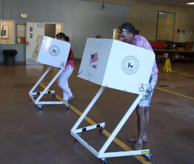 Bruce A.T. Siska and Lara DeSanti-Siska voted Tuesday at the East Hampton Village Emergency Services Building. Mr. Siska's father, Bruce Siska, lost his re-election bid.