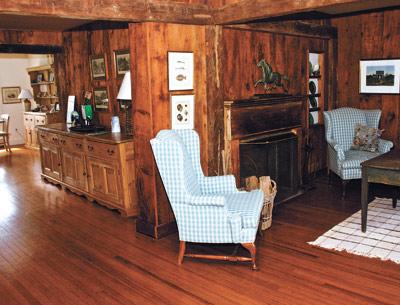 Wooden beams, along with wood walls and floors, speak of the house’s age, while most of the furnishings are vintage.