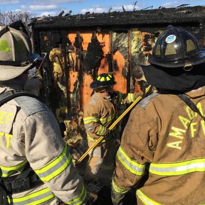 Firefighters surveyed the damage after a fire broke out at Lazy Point Thursday morning.