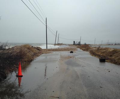 Waves from Gardiner's Bay during a storm in January overwashed a narrow section of Gerard Drive, causing officials to close the road. Consultants hired by East Hampton Town to develop a coastal assessment resiliency plan say the town's bayfront is more susceptible to impacts from storm surge and sea level than the oceanfront.