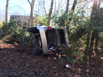 A Jeep Grand Cherokee rolled over onto its side after crashing into the woods on Wednesday morning.