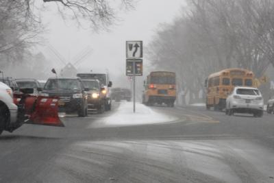 School buses were on the road early Monday afternoon to get students home before the snow got worse.