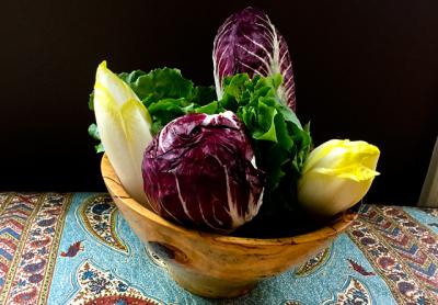 A mélange of bitter greens — in this case, escarole, radicchio, and endive — can be used raw or cooked to create different flavor profiles.