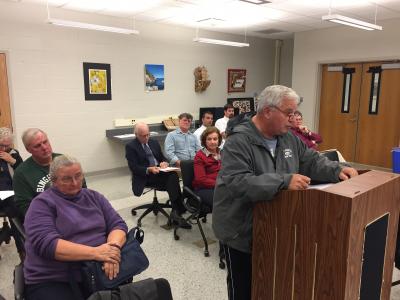 Vito Brulo, a resident of Pine Street who lives near the Cedar Street site proposed for the East Hampton School District's transportation depot, told the school board the residents would "aggressively pursue" their goal of having the district relocate the project.     Christine Sampson