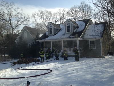 Firefighters got ready to enter a house on fire on Sea Farm Court in Bridgehampton Friday afternoon.