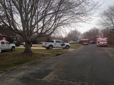 The scene outside the construction site at 45 Summerfield Lane in Water Mill on Tuesday afternoon while firefighters worked to free a man trapped by dirt that collapsed on him.