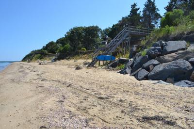 An eroding shoreline has four property owners asking the East Hampton Town Zoning Board of Appeals for the right to extend an existing revetment 560 feet south to protect their Louse Point Road houses.