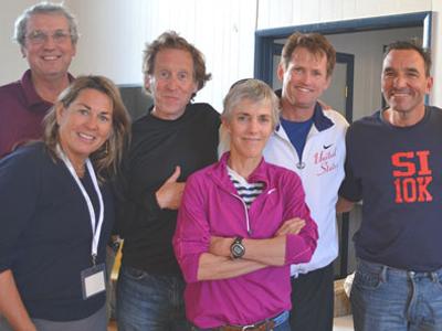 Mary Ellen Adipietro, left, and her husband, Frank Adipietro, at right, posed before last year’s Shelter Island 10K, which she directs, with Cliff Clark, one of the race’s founders, and Bill Rodgers, Joan Benoit Samuelson, and John Sinclair, three American marathon greats.