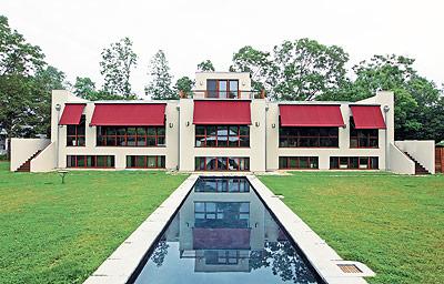 The south side of Don and Tori Matheson’s house in Springs is seen with awnings deployed for shade, above, and retracted for full sun, inset.