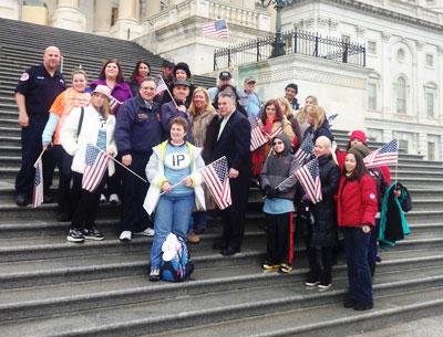 Representative Peter King, center, with a group of Long Island residents and people involved with the post-Sandy restoration effort who traveled to Washington on Tuesday for the House of Representative's vote on a $50.7 billion hurricane relief package.