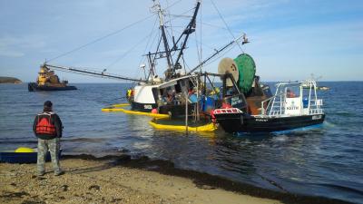 The Miss Scarlett, which ran aground just off Navy Beach in Montauk on Nov. 17, was towed across Long Island Sound on Tuesday.