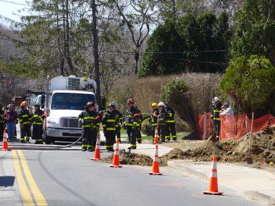 East Hampton firefighters stood by while National Grid remedied a gas leak, caused when the Suffolk County Water Authority hit an abandoned gas service on Toilsome Lane on Thursday morning, Chief Richard Osterberg Jr. said.