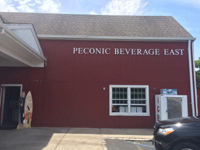 A notice to customers written on the Dos Equis beer man's sign reads, "I don't always drink beer, but when I do, I buy it from Peconic Beverage," while notifying them of the last day and to thank them for shopping.