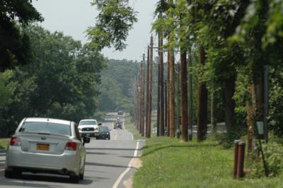 Utility lines like these along Town Lane in Amagansett could be buried using money raised through a special taxing district following Gov. Andrew M. Cuomo’s signing of legislation allowing towns to create “underground utility improvement districts.”