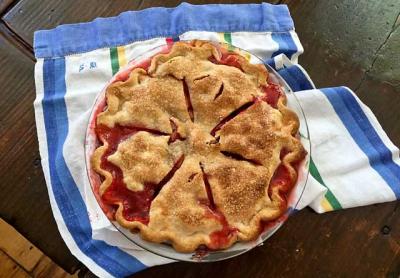 Use a glass pan for a strawberry rhubarb pie so you can check the bottom of the crust. It is also a good idea to watch it carefully and have something in the oven below the pan to catch the sticky overflow juices.