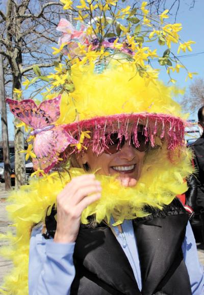 Participants in the Sag Harbor Chamber of Commerce’s Easter Bonnet Parade on Saturday vied to top (pun intended) each other with the zaniest creations. Above, the feathers in Heidi Swindells’s bonnet matched the fresh forsythia sprouting from it. Below, Melanie Pineda cozied up to the Easter Bunny.