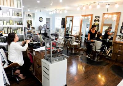 Annie Kim, the owner of the Scarlett Rose salon, hopes her business can remain in its Division Street location despite the sale of the property.